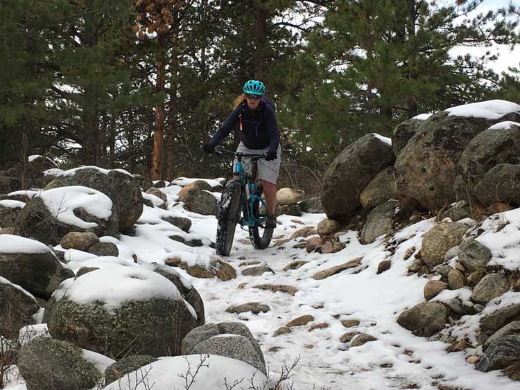 Woman fat tire biking in Johnson County Wyoming