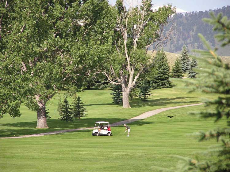 Couple golfing at golf course in Buffalo Wyoming