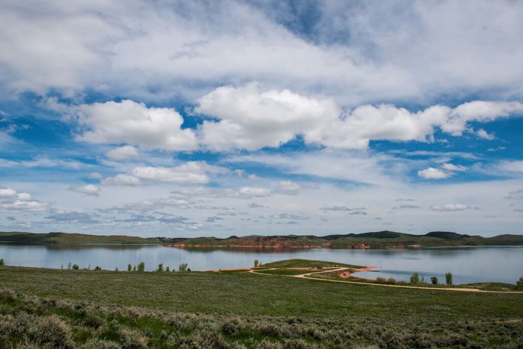 A scenic view of Lake DeSmet near Buffalo, Wyoming, known for excellent trout fishing and beautiful open water.