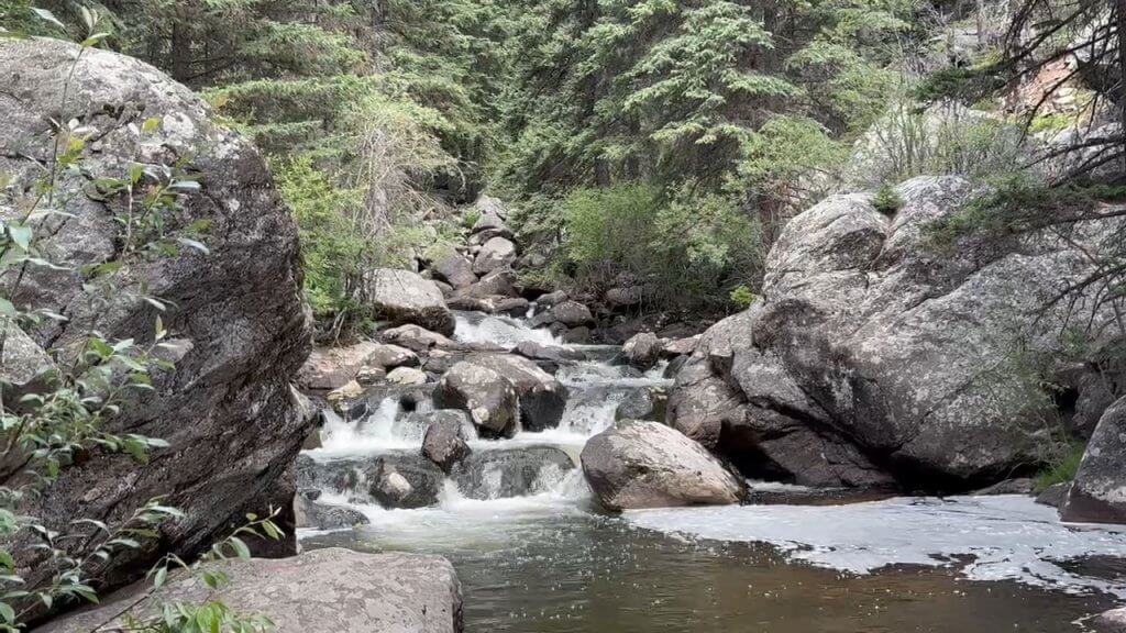 A cascading mountain stream along South Fork Clear Creek in the Bighorn Mountains, a great spot for trout fishing in Wyoming.