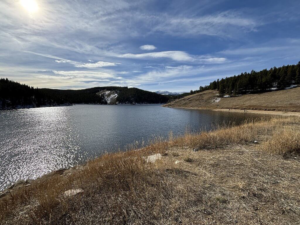 A scenic view of Tie Hack Reservoir in the Bighorn Mountains, a great location for trout fishing near Buffalo, Wyoming.