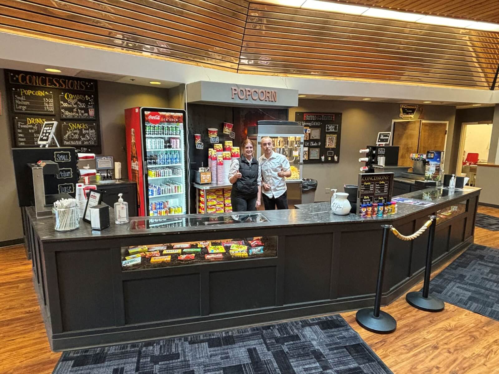 The lobby of Buffalo Theater with a popcorn stand, offering a fun indoor activity for families in Buffalo, WY.