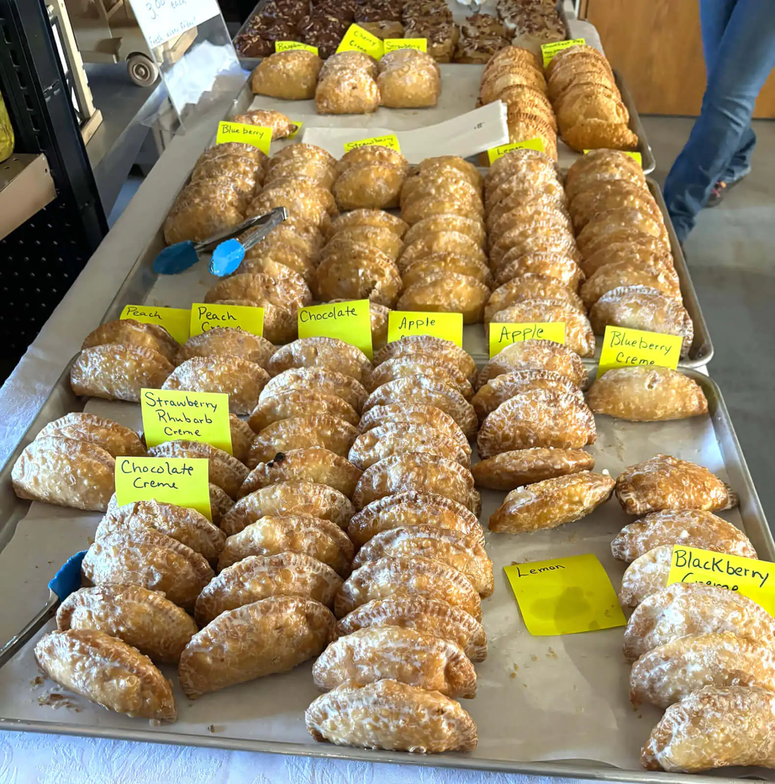 A variety of freshly baked donuts at Yoder's Country Store, a delightful treat for families visiting Buffalo, WY.