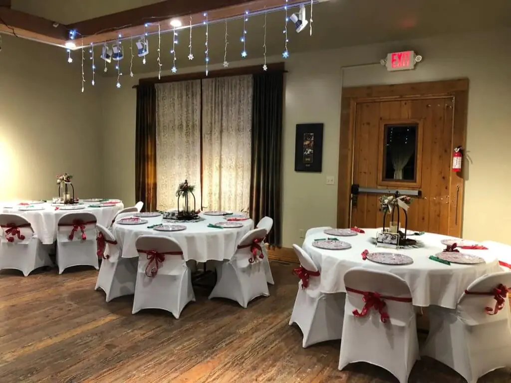 Interior view of the Cowboy Carousel Center in Buffalo, Wyoming, set up for an elegant event with decorated tables, ideal for meeting venues and event spaces.