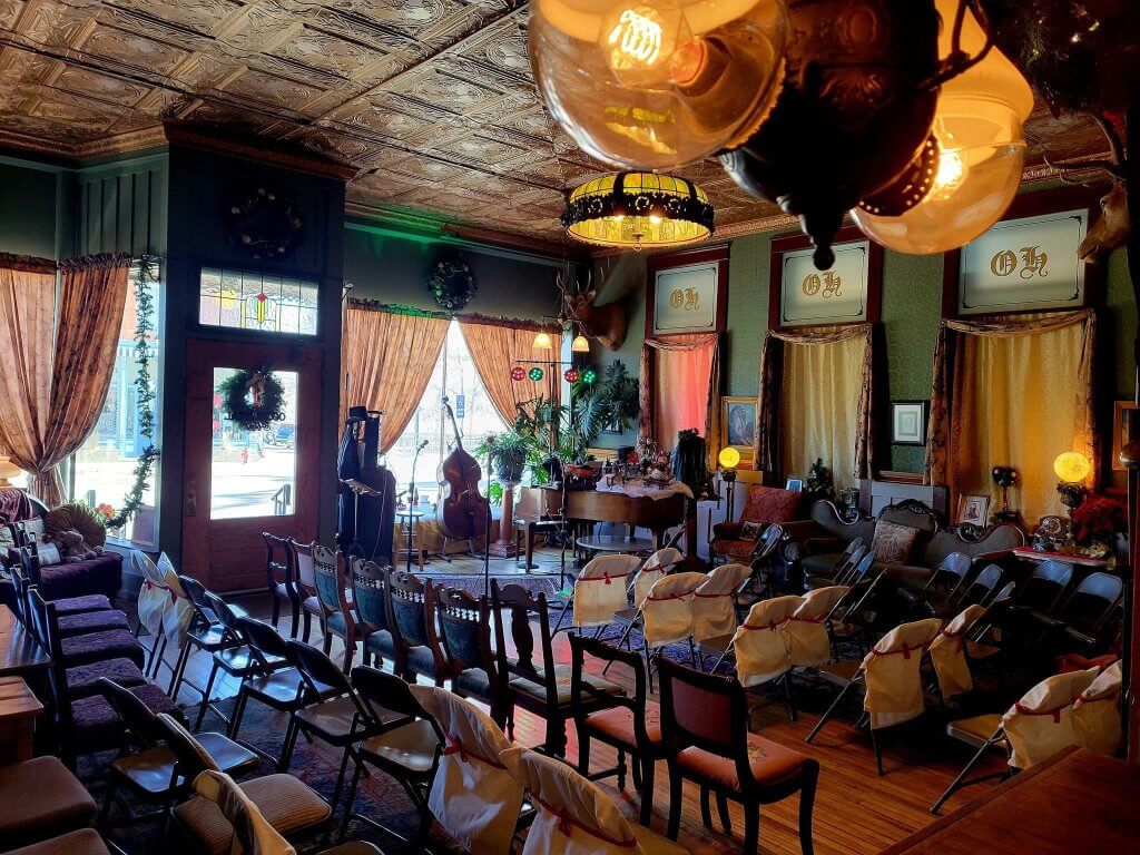 Charming interior of the Historic Occidental Hotel & Saloon in Buffalo, Wyoming, showcasing a vintage-style event space with elegant decor and seating arrangements.