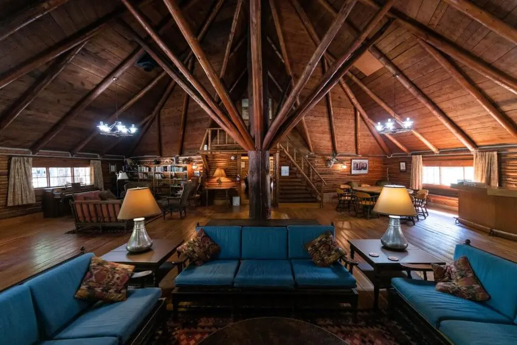 Rustic interior of Spear-O-Wigwam Lodge in Buffalo, Wyoming, featuring cozy seating, exposed wooden beams, and a warm ambiance ideal for retreats and events.