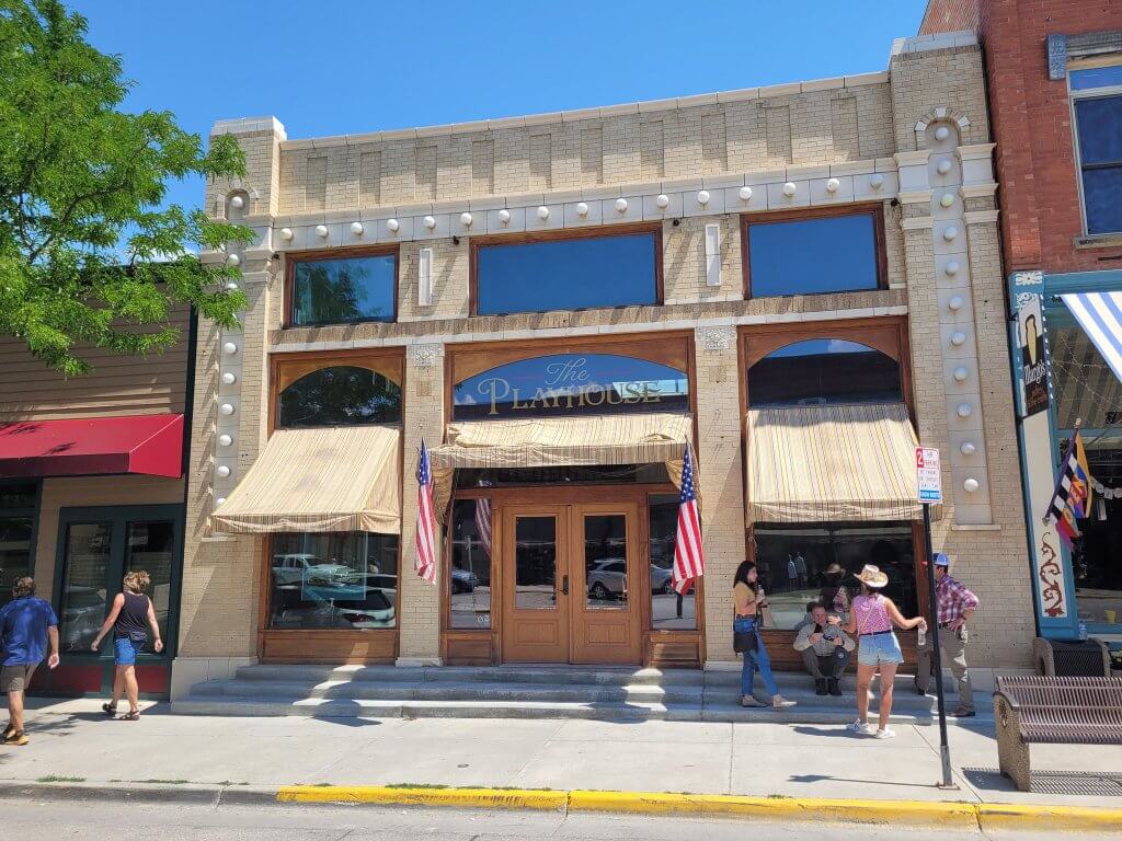 Exterior view of The Playhouse, a versatile event venue in Buffalo, Wyoming, featuring a historic facade with welcoming entrance and classic design.