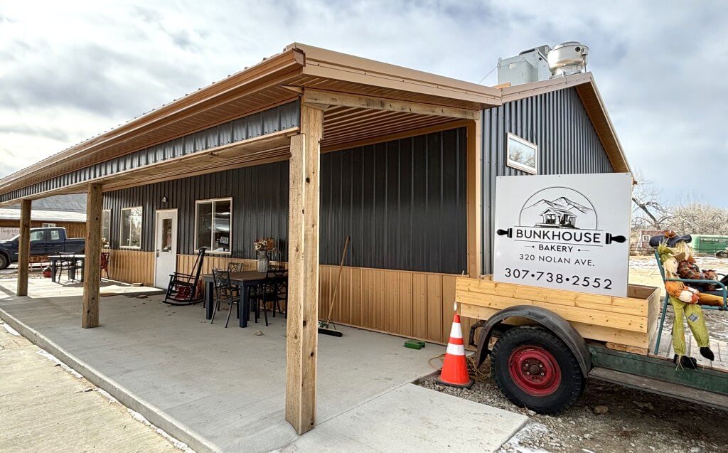 Hole in the Wall Local dining destination at Bunkhouse Bakery offering outdoor seating under covered pavilion with authentic western atmosphere and antique farm displays