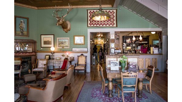20 Free and Budget-Friendly Things to Do in Buffalo, Wyoming Historic interior of the Occidental Hotel lobby with taxidermy mounts, wood floors, and antique furniture.