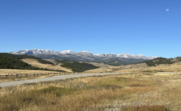 20 Free and Budget-Friendly Things to Do in Buffalo, Wyoming Panoramic view from Hospital Hill showing open range and the snowcapped Bighorn Mountains in the background.