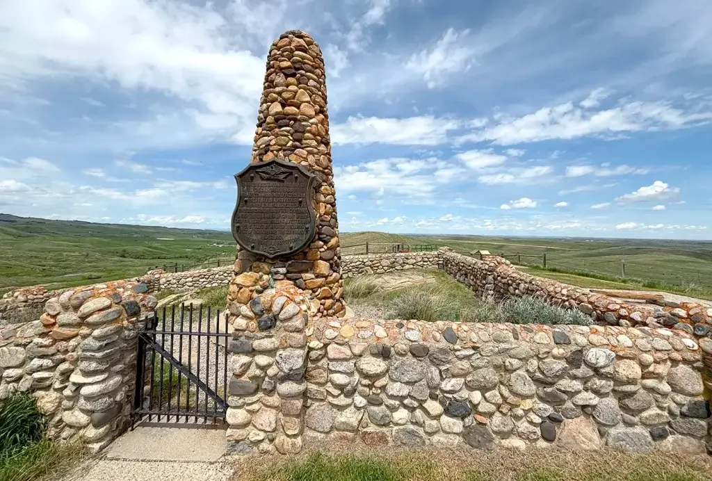 A plaque on a stone pillar at Fort Phil Fetterman Monument.