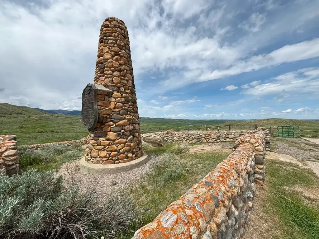 A stone pillar looming in For Phil Fetterman Monument.