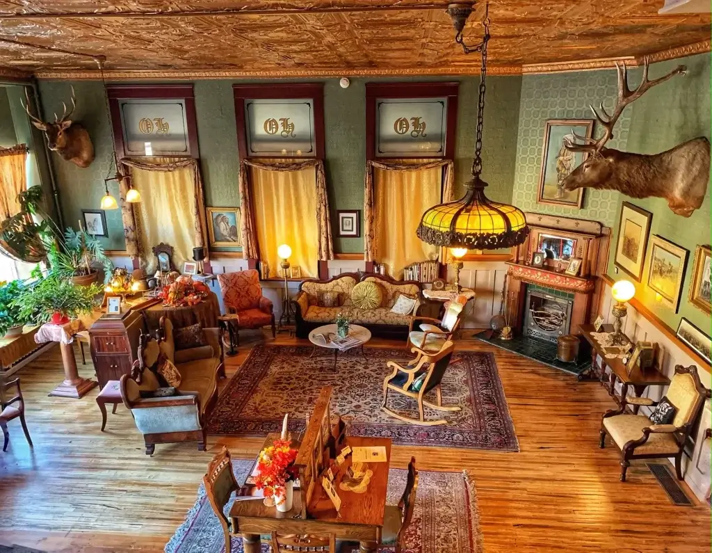 A lobby filled with antique furniture and animal busts at the Haunted Historic Occidental Hotel.