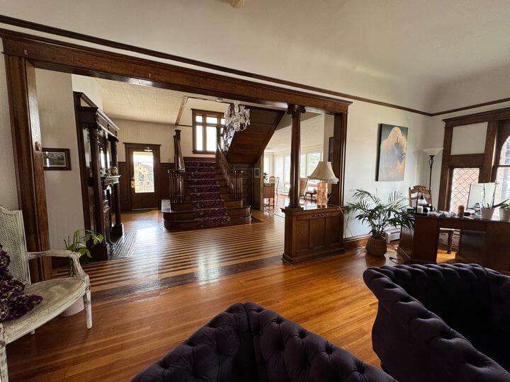 The grand staircase in the main lobby or living space of the Buffalo Inn hotel in Buffalo, Wyoming
